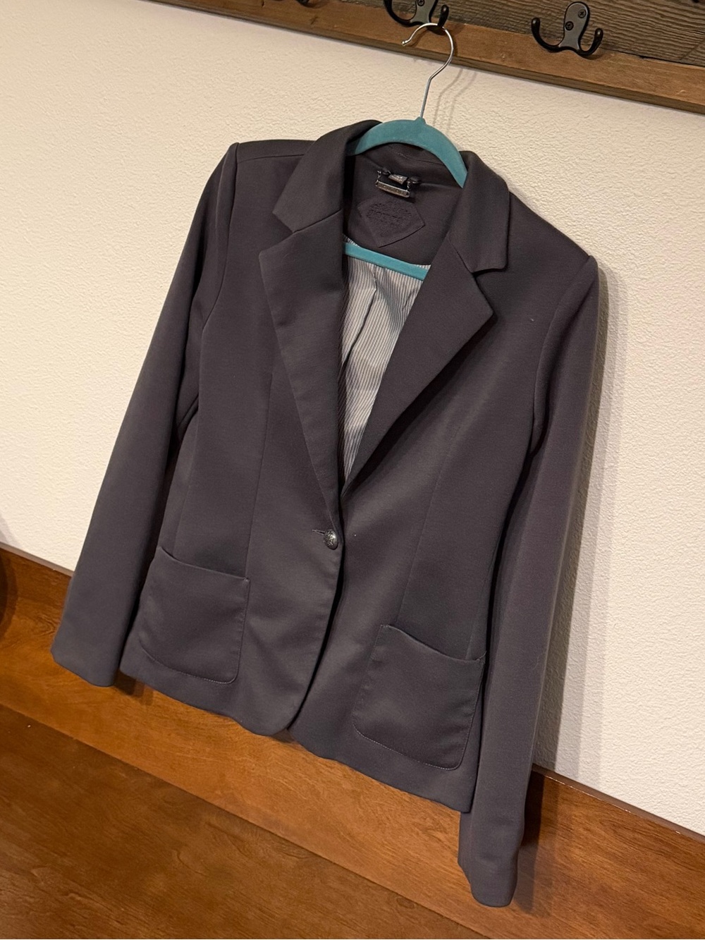 Jou Jou black jacket with brass-tone logo plate